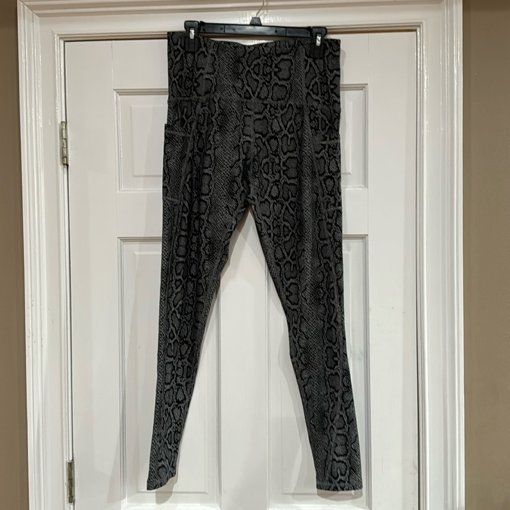 Champion snake print leggings with side pockets.